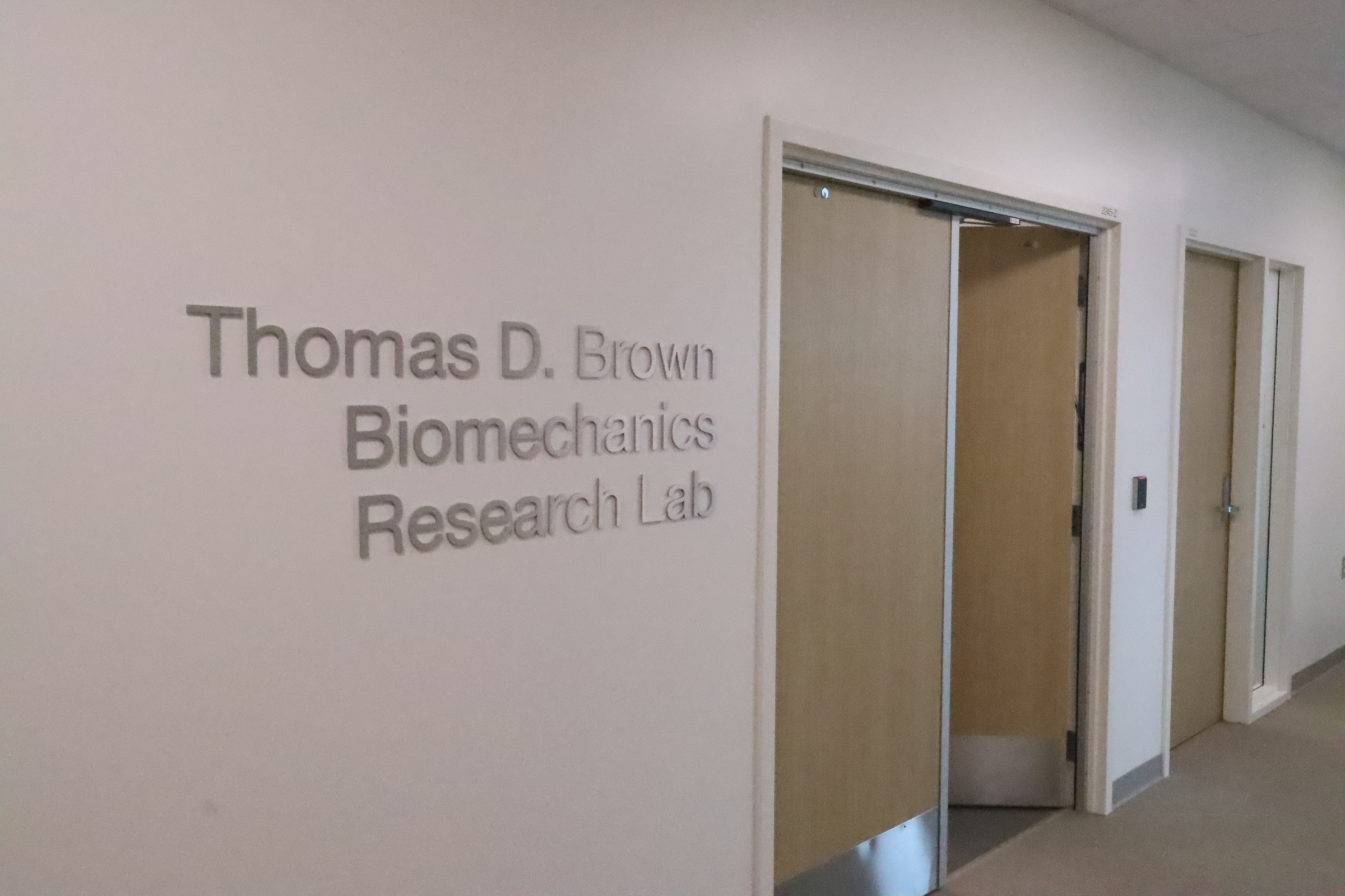 Image of the doorway to the lab showing the name Thomas D Brown Research Lab